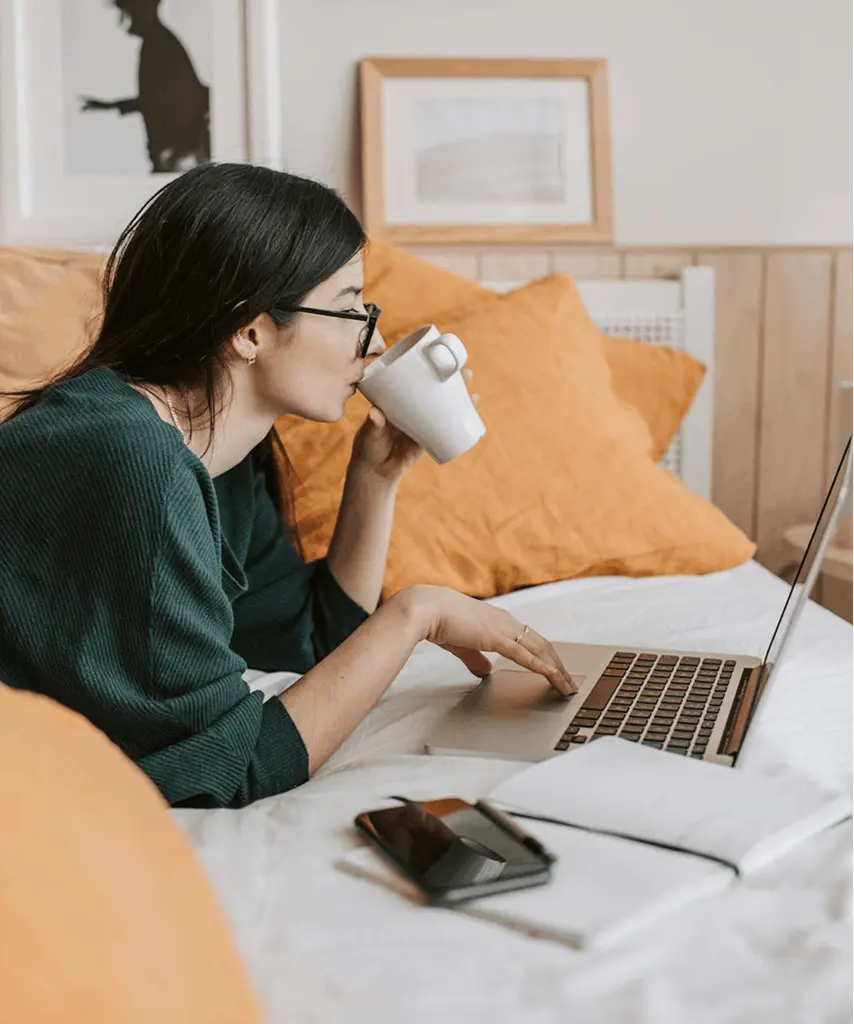 Young freelancer studying or working remotely on a laptop from home