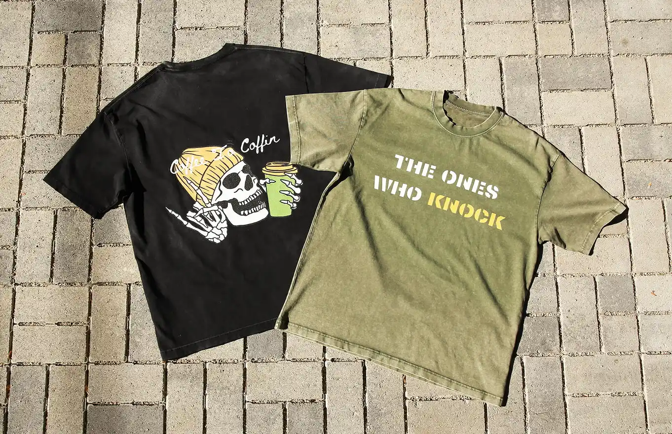 Two custom shirts - one with a nice pattern and the other with plain text printed directly on the floor.