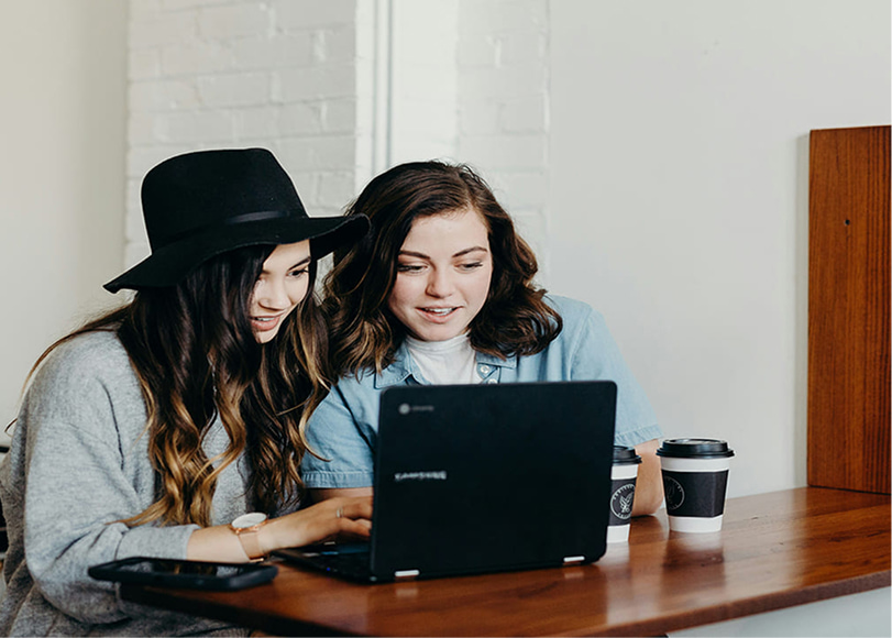 two women discussing business ideas and planning a venture